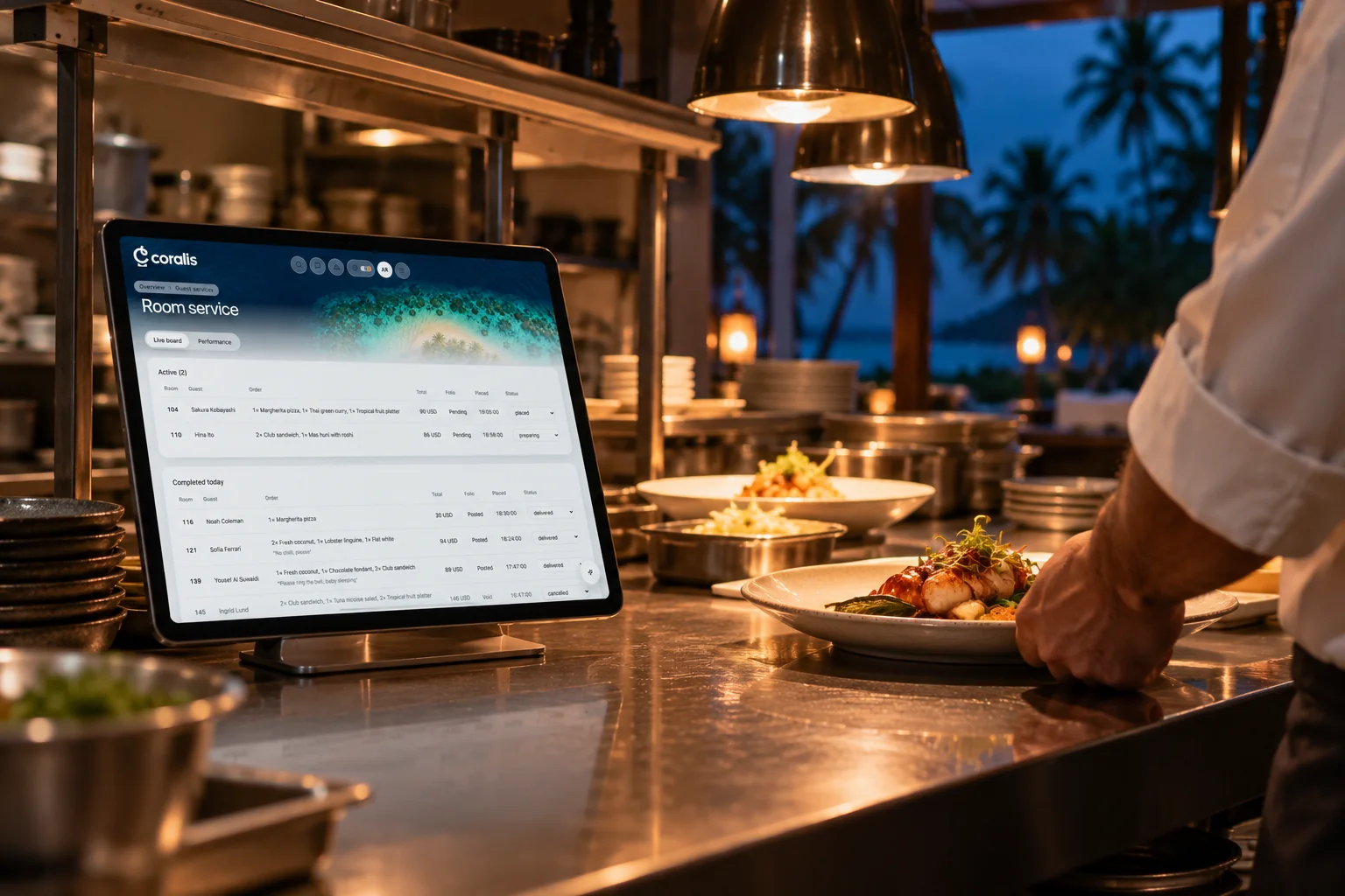 A tablet on the kitchen pass showing room service orders.
